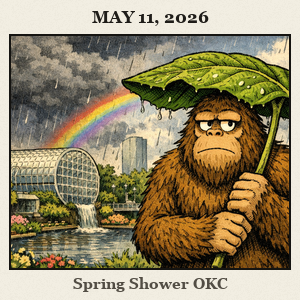 Friendly Bigfoot in Myriad Botanical Gardens shielding with a giant leaf as rain passes and a small rainbow appears.