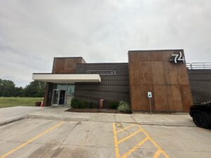 Exterior of 74 Sports Kitchen and Cocktails in Oklahoma City with the 74 sign on the building