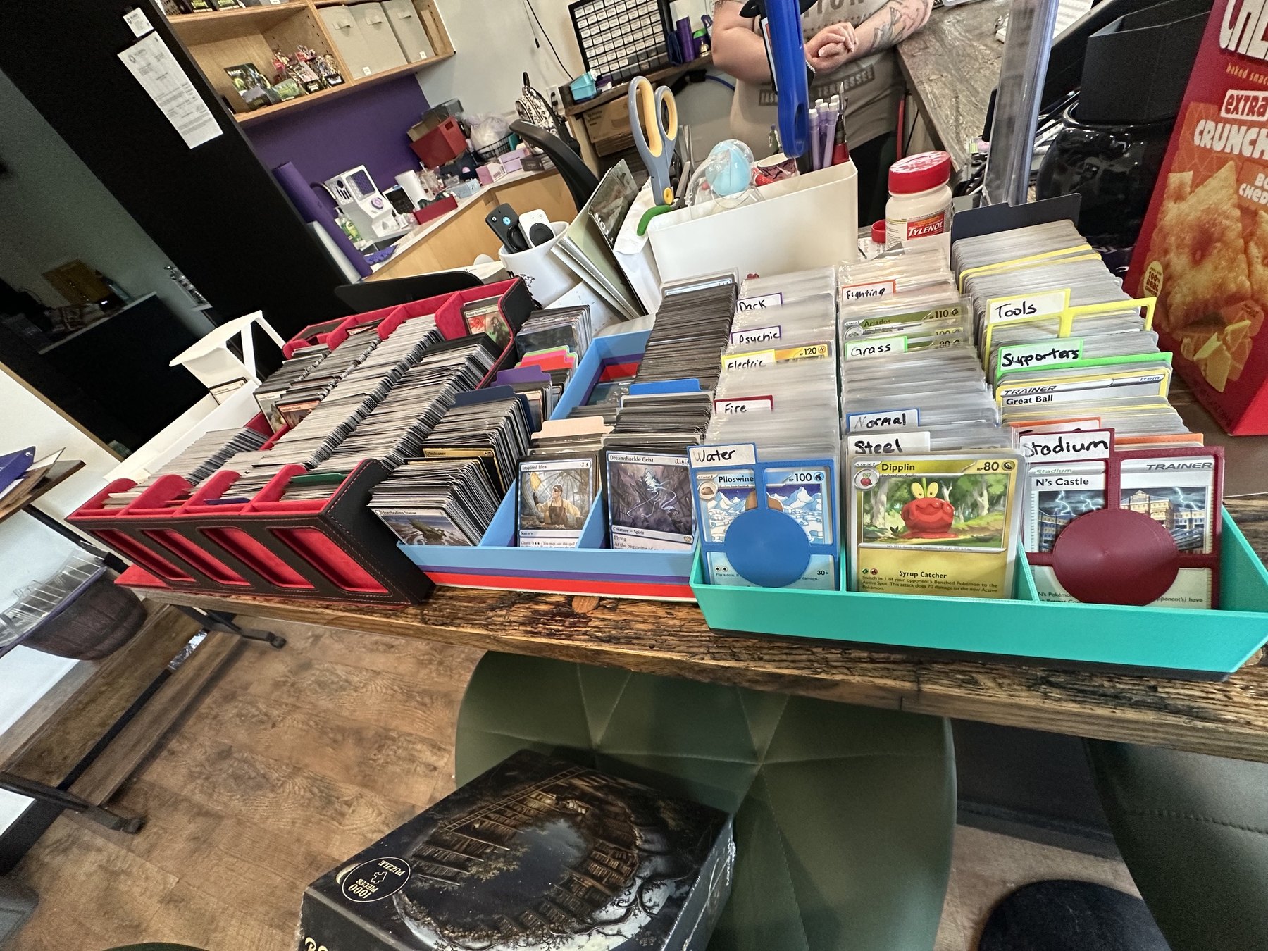 Trading cards organized in trays at Side Quest Game Lounge in Oklahoma City