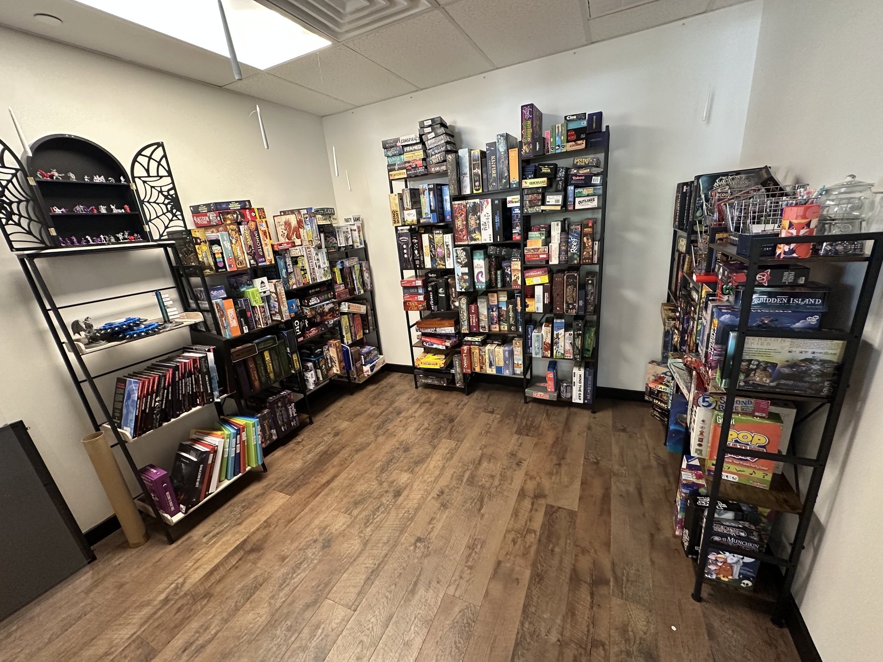 Board game shelves inside Side Quest Game Lounge in Midtown Oklahoma City