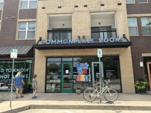 Exterior storefront of Commonplace Books in Midtown OKC with sign above the entrance.