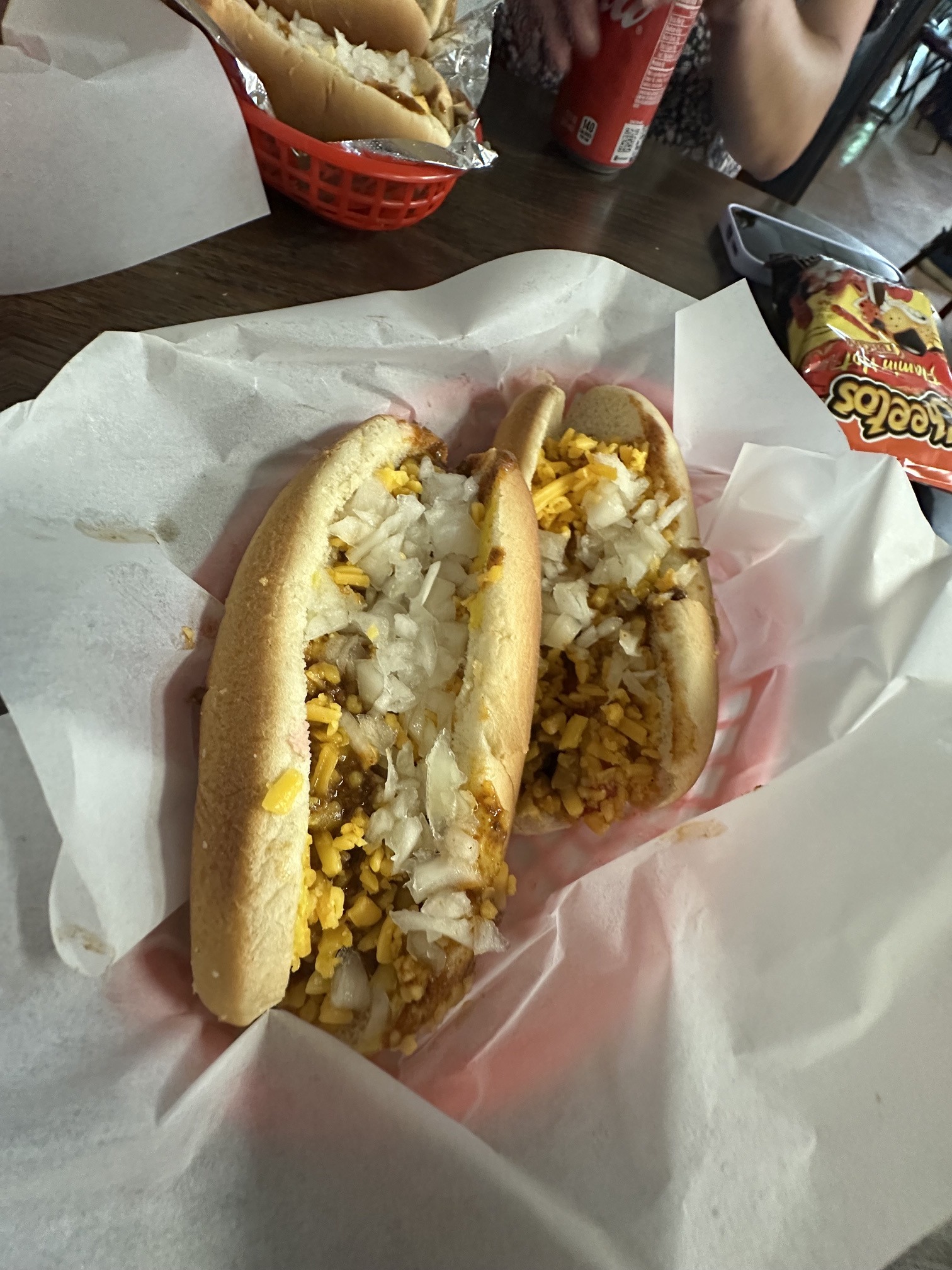 Two chili cheese coneys with chopped onions at Coney Island Downtown OKC.