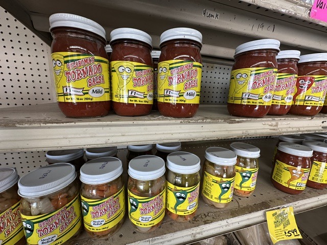 Jars of Oklahoma’s Tornado Salsa displayed on shelves inside Pinata Store
