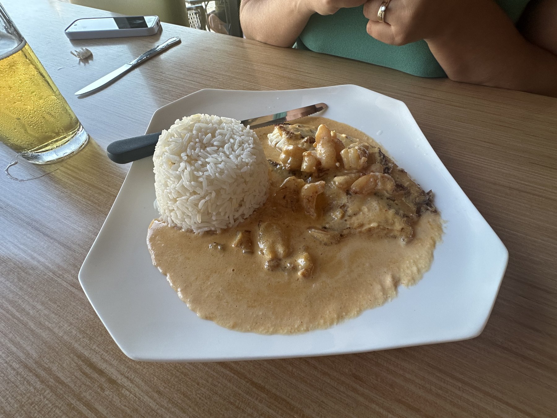 Asian Cajun loaded tilapia with shrimp cream sauce and white rice at Riviere Modern Banh Mi in Oklahoma City.