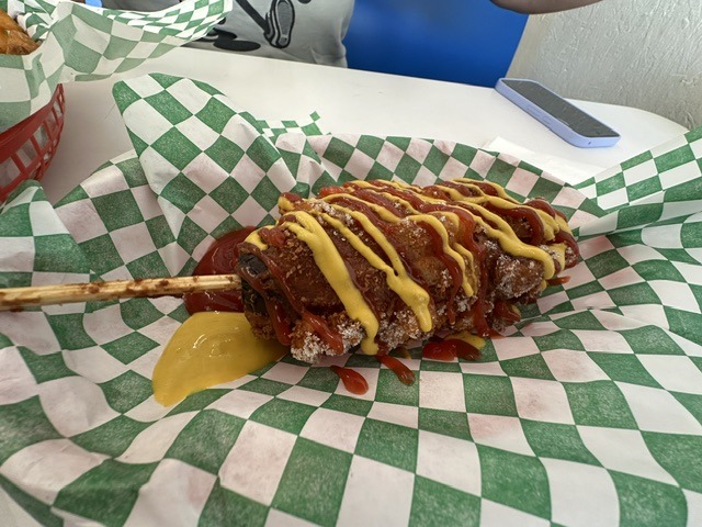 Vegan corn dog from Shaq’s Vegan Dogs in Oklahoma City topped with mustard and ketchup