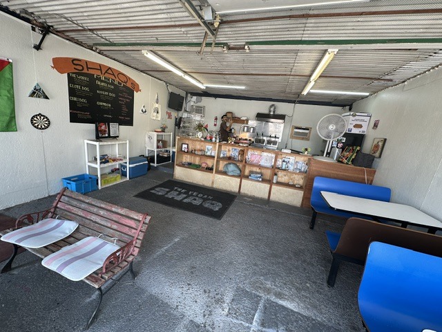 Interior of Shaq’s Vegan Dogs in Oklahoma City with counter, menu board, and casual seating