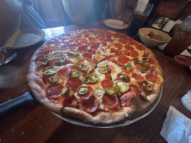 Pepperoni and jalapeno pizza served at The Original Hideaway Pizza in Stillwater, Oklahoma.