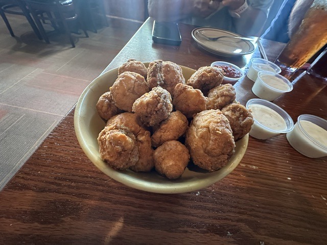 Fried appetizer bites with dipping sauces at The Original Hideaway Pizza in Stillwater.