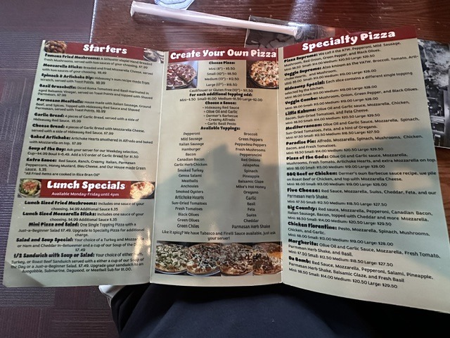 Open menu at The Original Hideaway Pizza showing starters, lunch specials, and specialty pizzas.