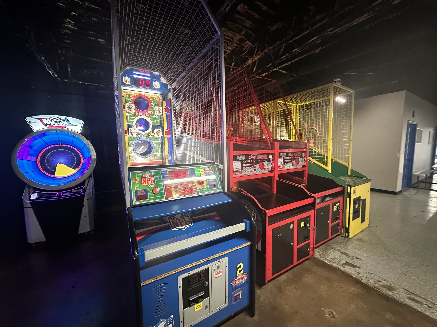 Basketball arcade games and skill machines lined up inside Cactus Jack’s Family Fun Center in OKC.