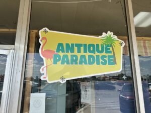 Antique Paradise storefront window sign in Norman, Oklahoma
