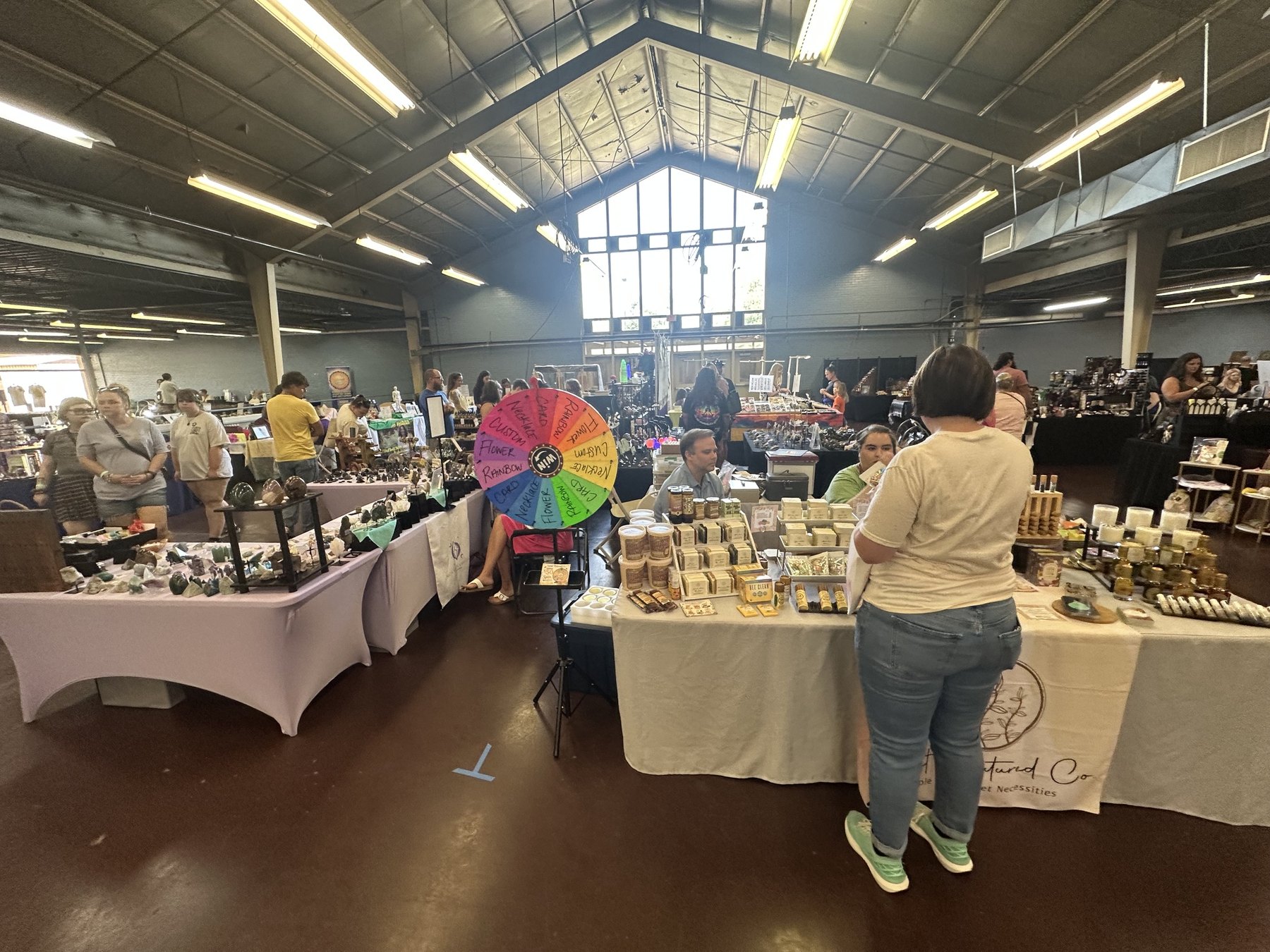 Shoppers browse wellness and metaphysical vendor booths at the Gypsy Soul Fair in Oklahoma.