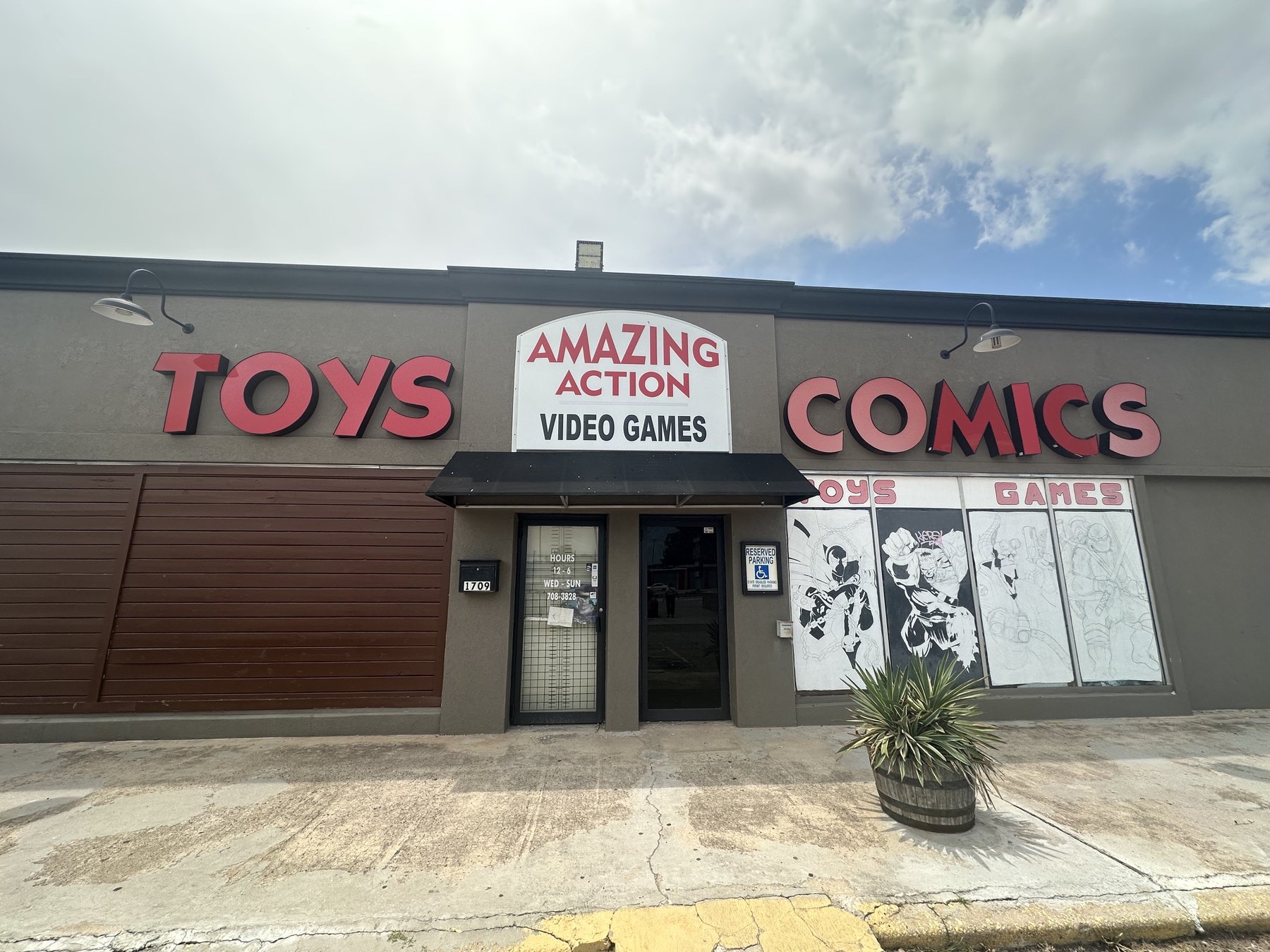 Exterior of Amazing Action in Oklahoma City with large Toys and Comics signs above the entrance
