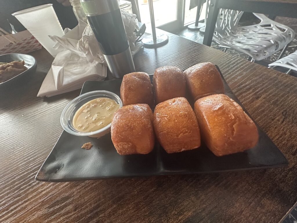 Golden fried buns with condensed milk dipping sauce at Formosa Street Food and Bar in Oklahoma City