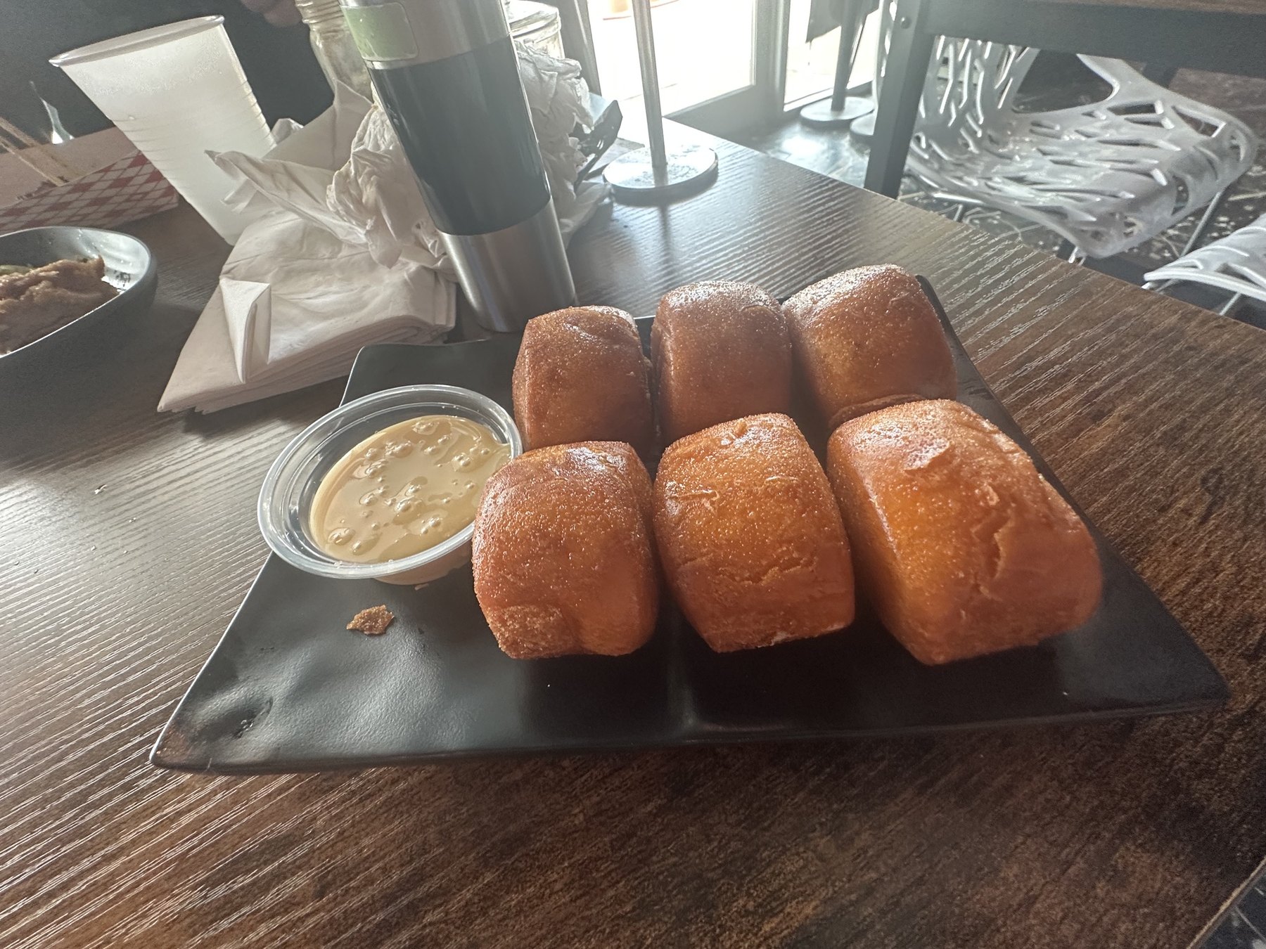 Golden fried buns with condensed milk dipping sauce at Formosa Street Food and Bar in Oklahoma City