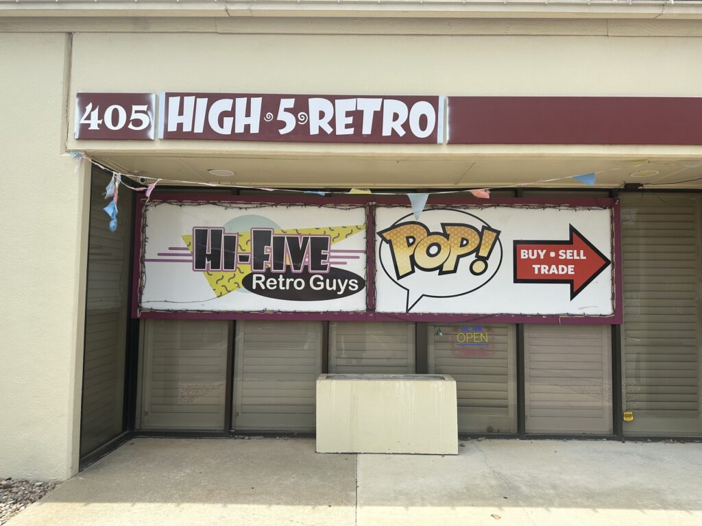 Storefront sign for High 5 Retro Guys toys, games, collectibles, and Funko Pops in Oklahoma City