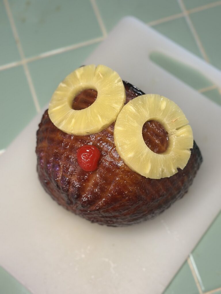 Finished Rum Ham glazed and decorated with pineapple rings and a maraschino cherry