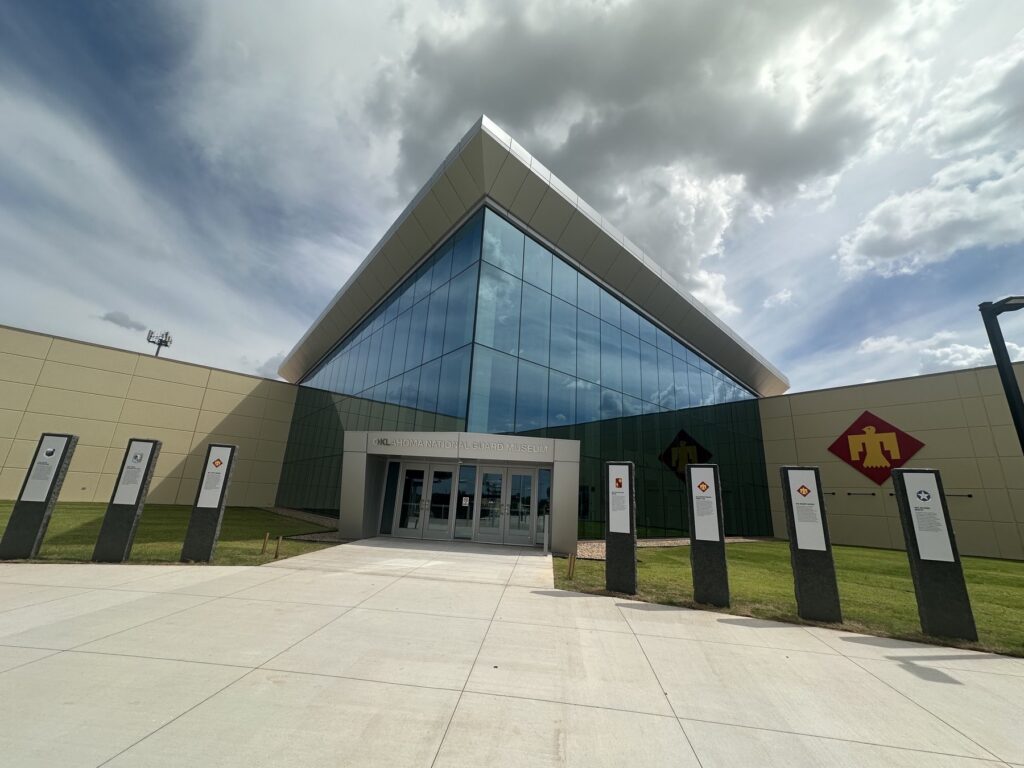 Exterior entrance of the Oklahoma National Guard Museum in Oklahoma City under a cloudy sky