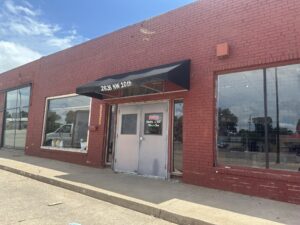 Exterior of Timeless Furniture's OKC location at 2833 NW 10th with a black awning over the entrance.