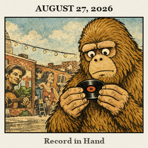 Bigfoot in Tulsa's Brick Arts District holds a small vinyl record in both hands, examining its grooves.