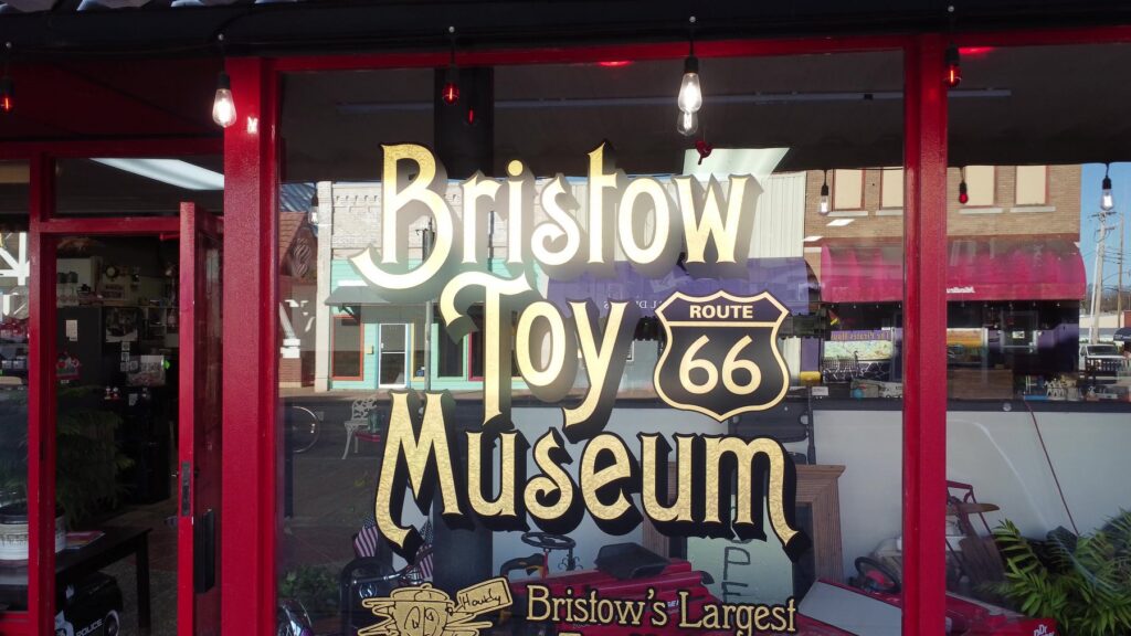 Front window sign for the Bristow Toy Museum on Route 66 in Bristow, Oklahoma.