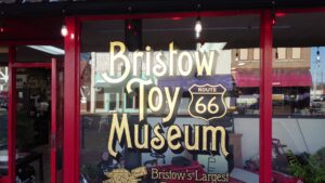 Front window sign for the Bristow Toy Museum on Route 66 in Bristow, Oklahoma.