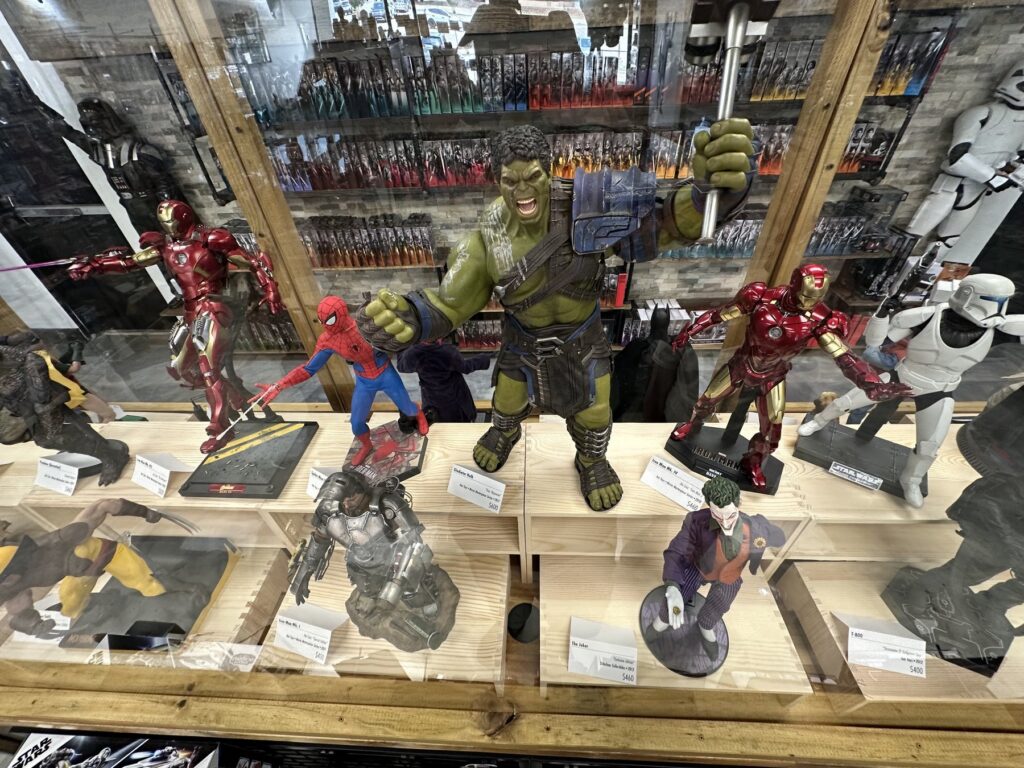 Collectible Hulk, Spider-Man, Iron Man, Joker, Wolverine, and Star Wars figures displayed at Figure This! Toys in Edmond.