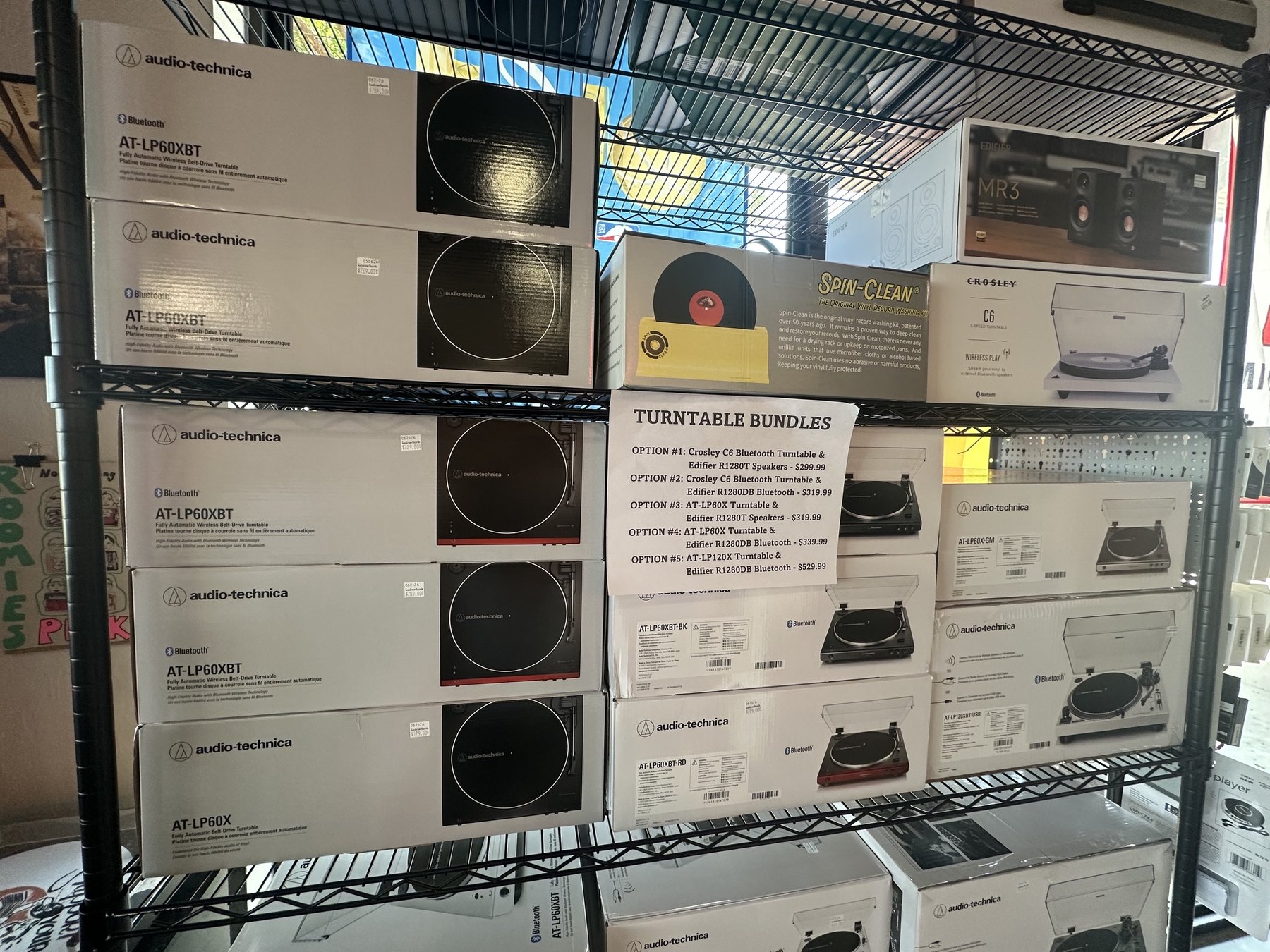 Boxed turntables and audio equipment for sale at Guestroom Records Edmond.