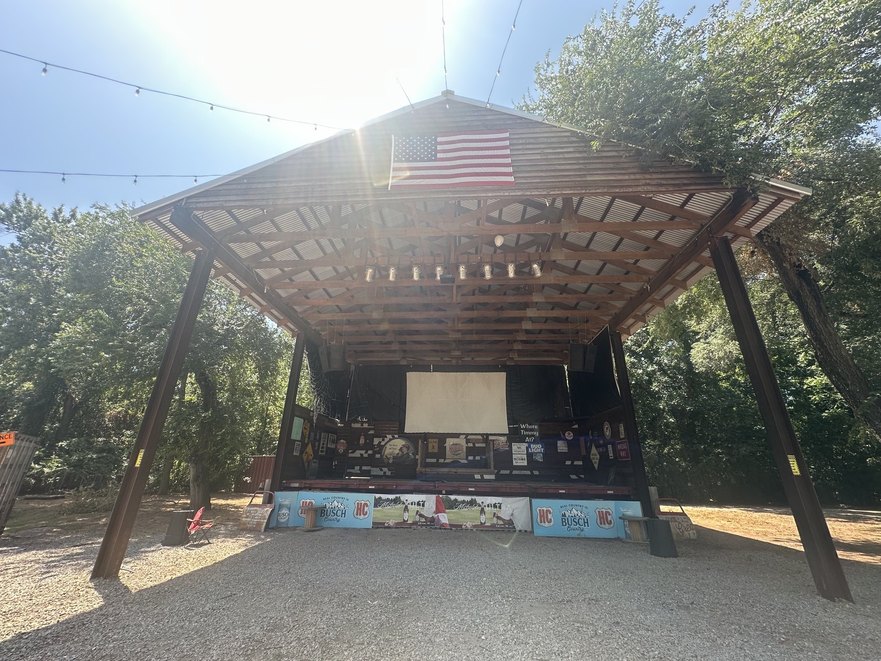Wide view of the covered outdoor stage at Hollywood Corners in Norman, Oklahoma.