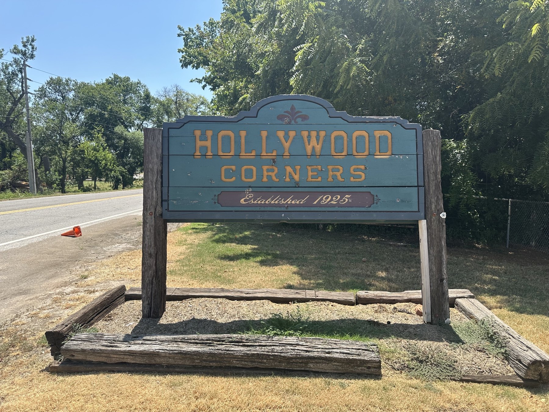 Roadside Hollywood Corners sign with Established 1925 text in Norman, Oklahoma.