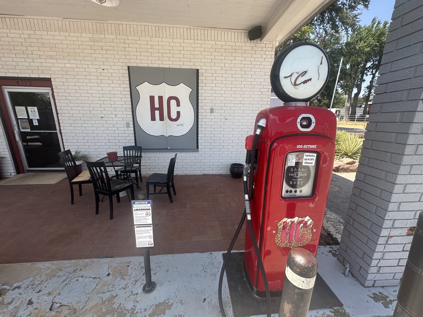 Vintage red gas pump on the patio at Hollywood Corners in Norman, Oklahoma.