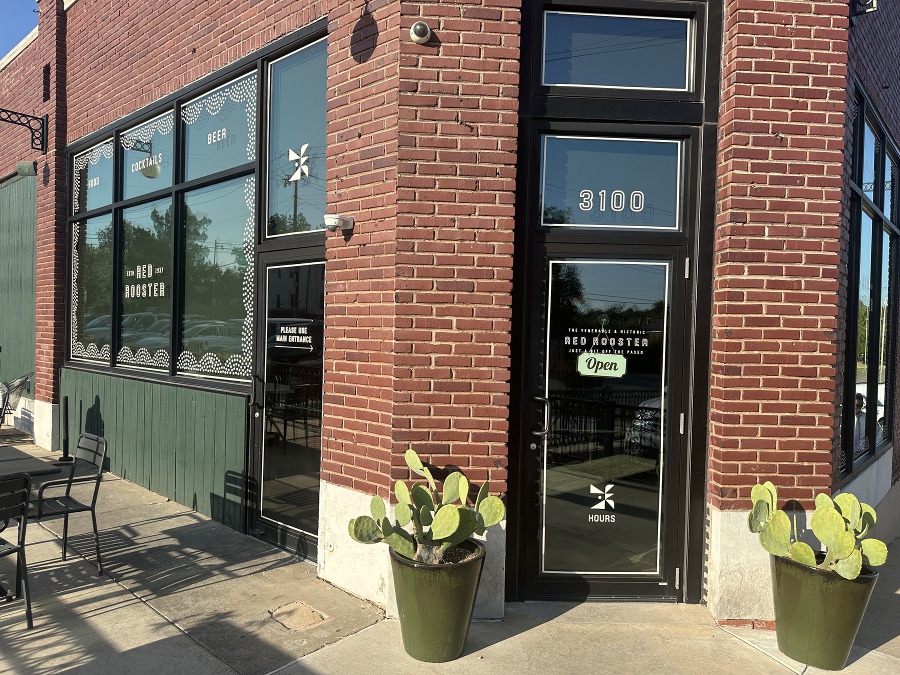 Front door and window signage for Red Rooster at 3100 in Oklahoma City