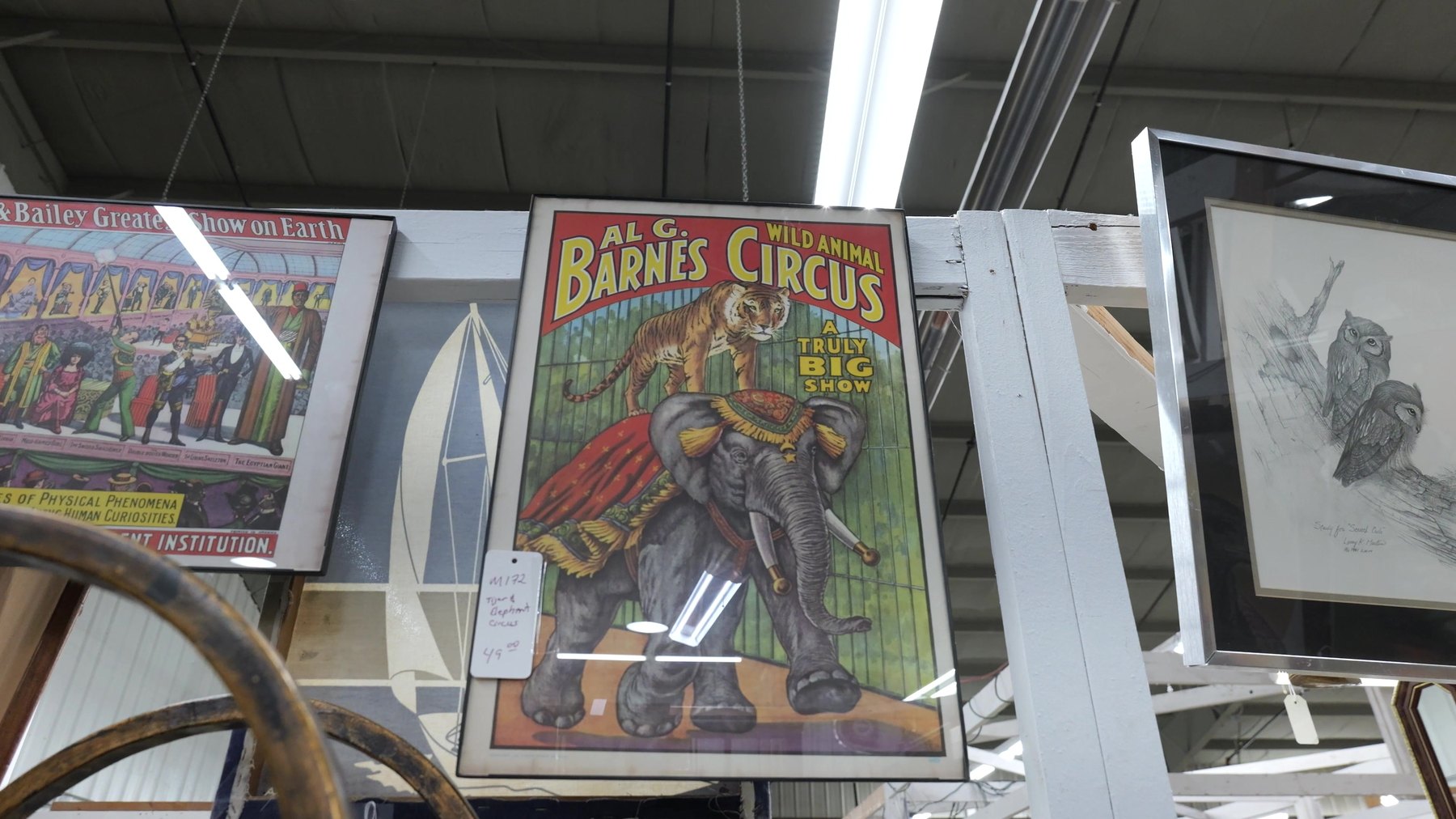 Framed circus poster and vintage artwork at The Rink Gallery in Bethany, Oklahoma.