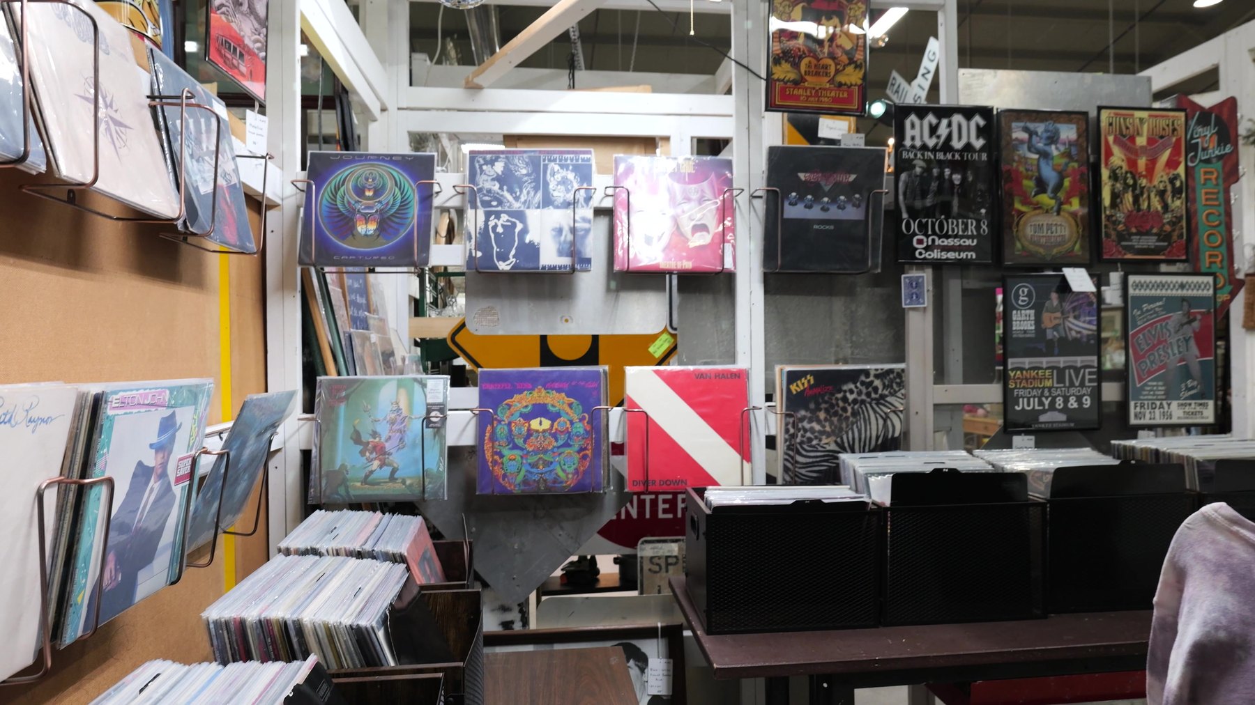 Vinyl records and classic rock posters at The Rink Gallery in Bethany, Oklahoma.