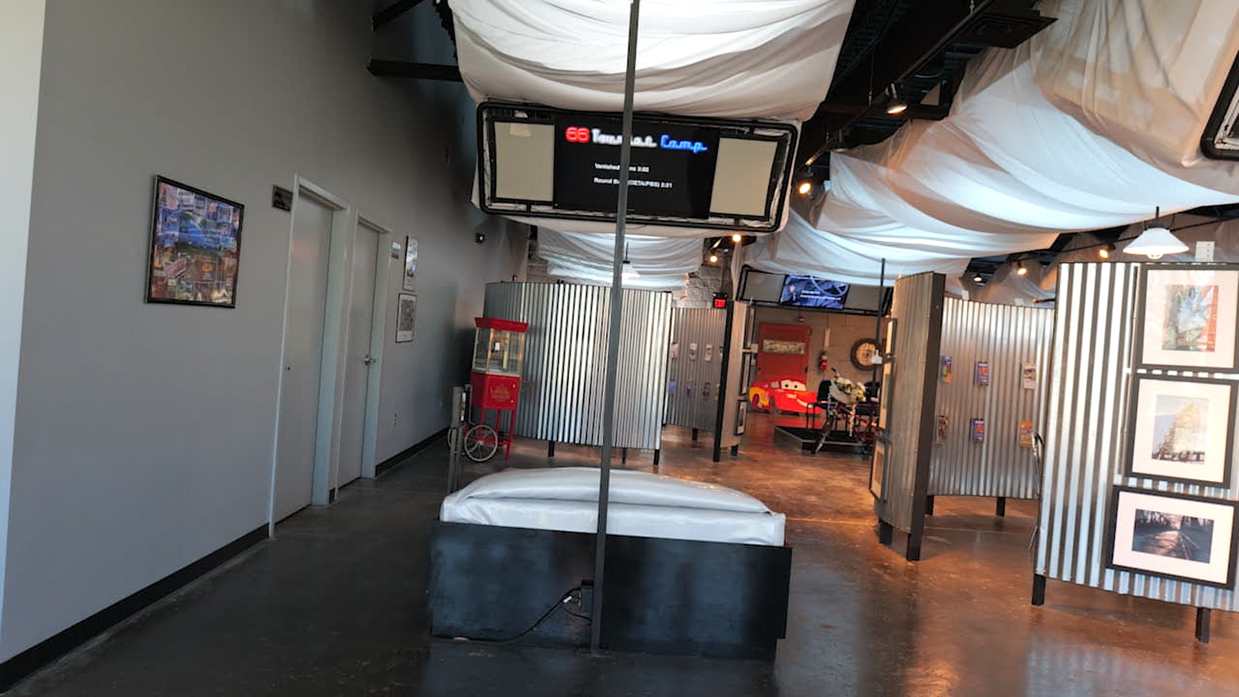 Motel-style bed and video exhibit inside the Route 66 Interpretive Center