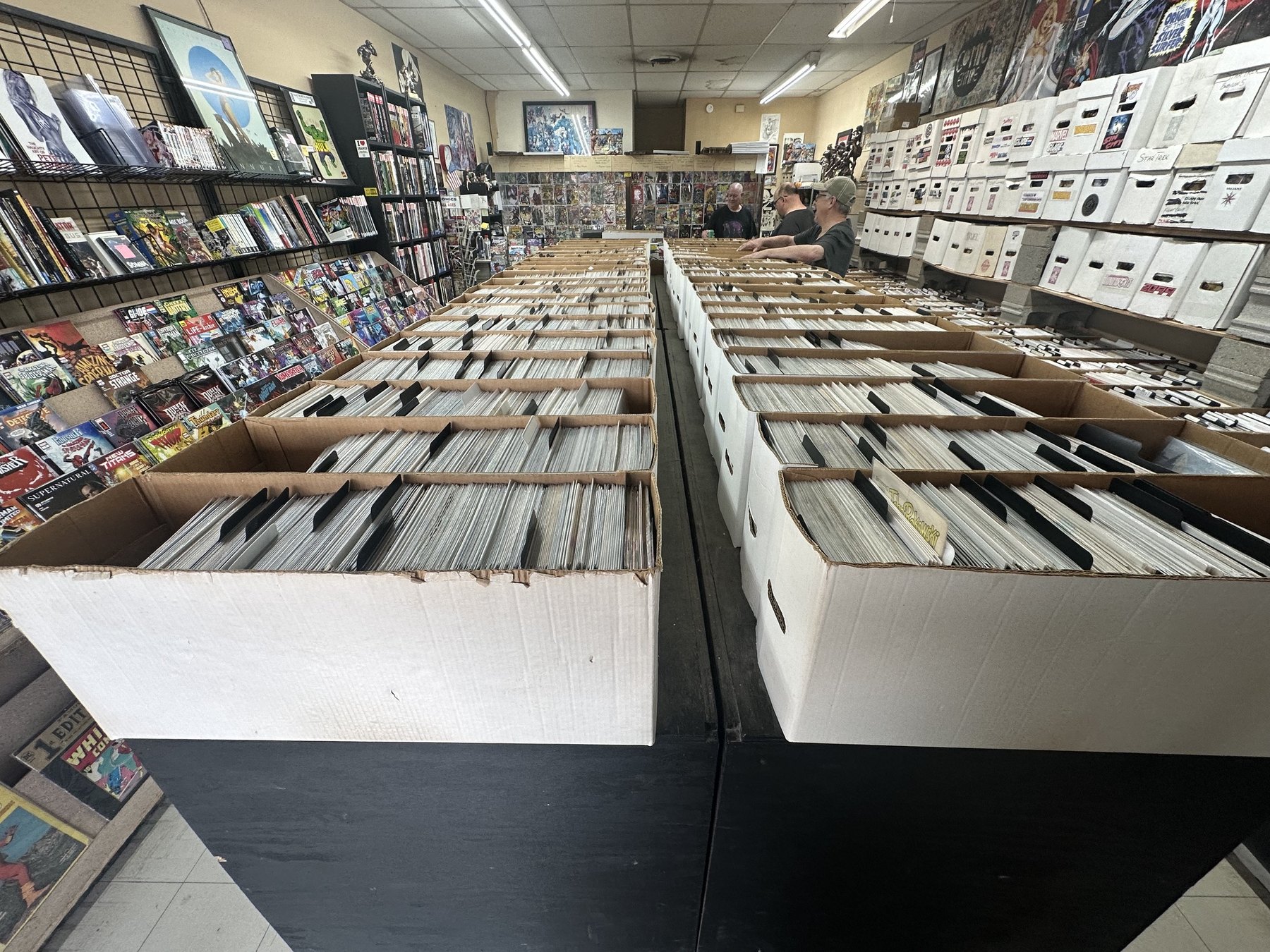 Rows of long boxes filled with comics inside The Comic Empire in Tulsa