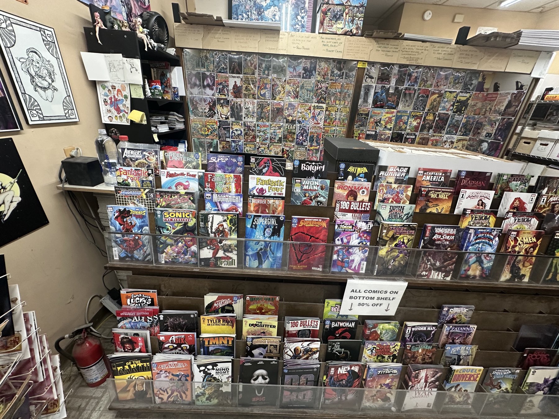 Comic racks and discount shelves inside The Comic Empire in Tulsa