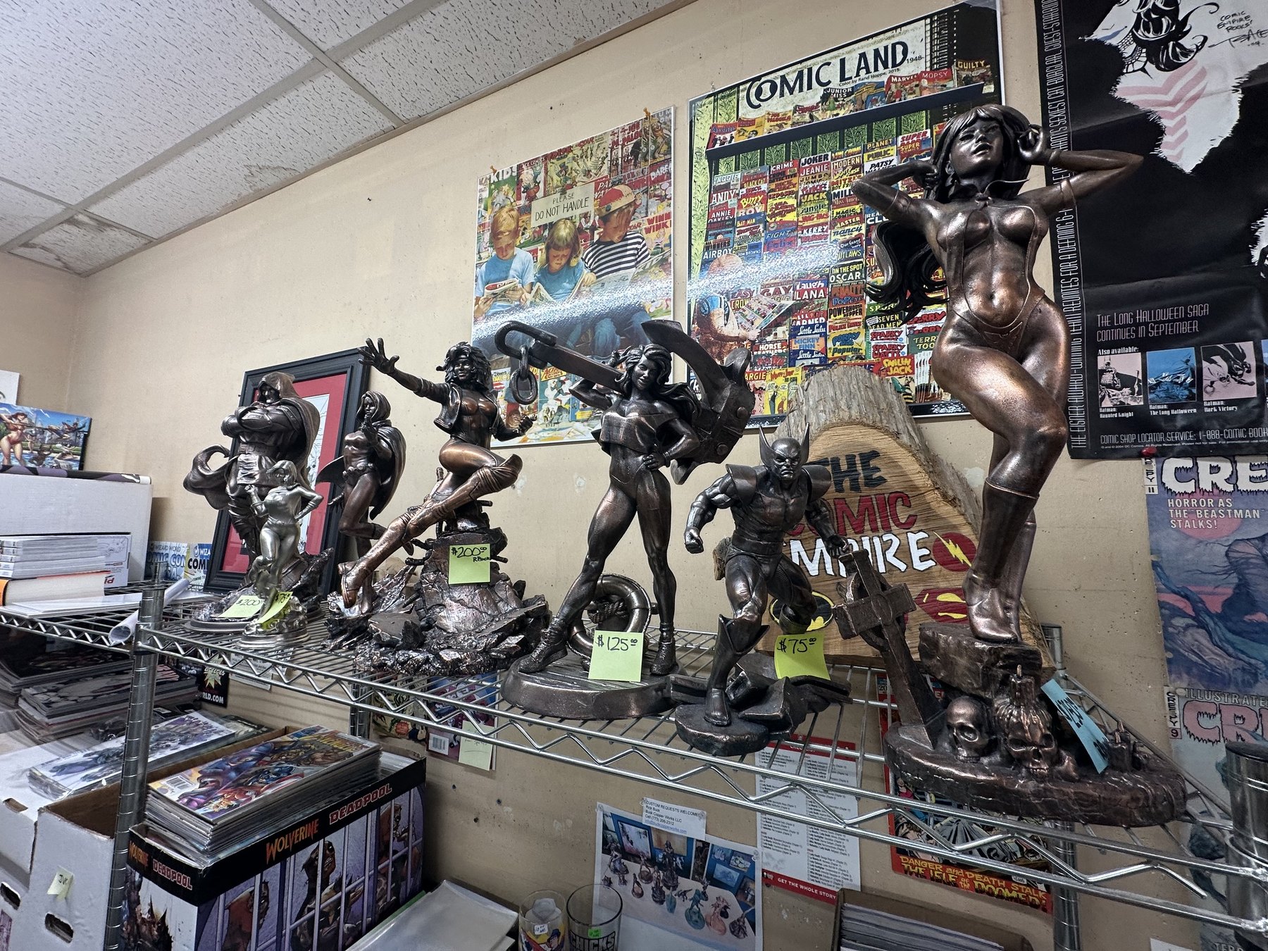 Collectible superhero and comic character statues on display at The Comic Empire in Tulsa