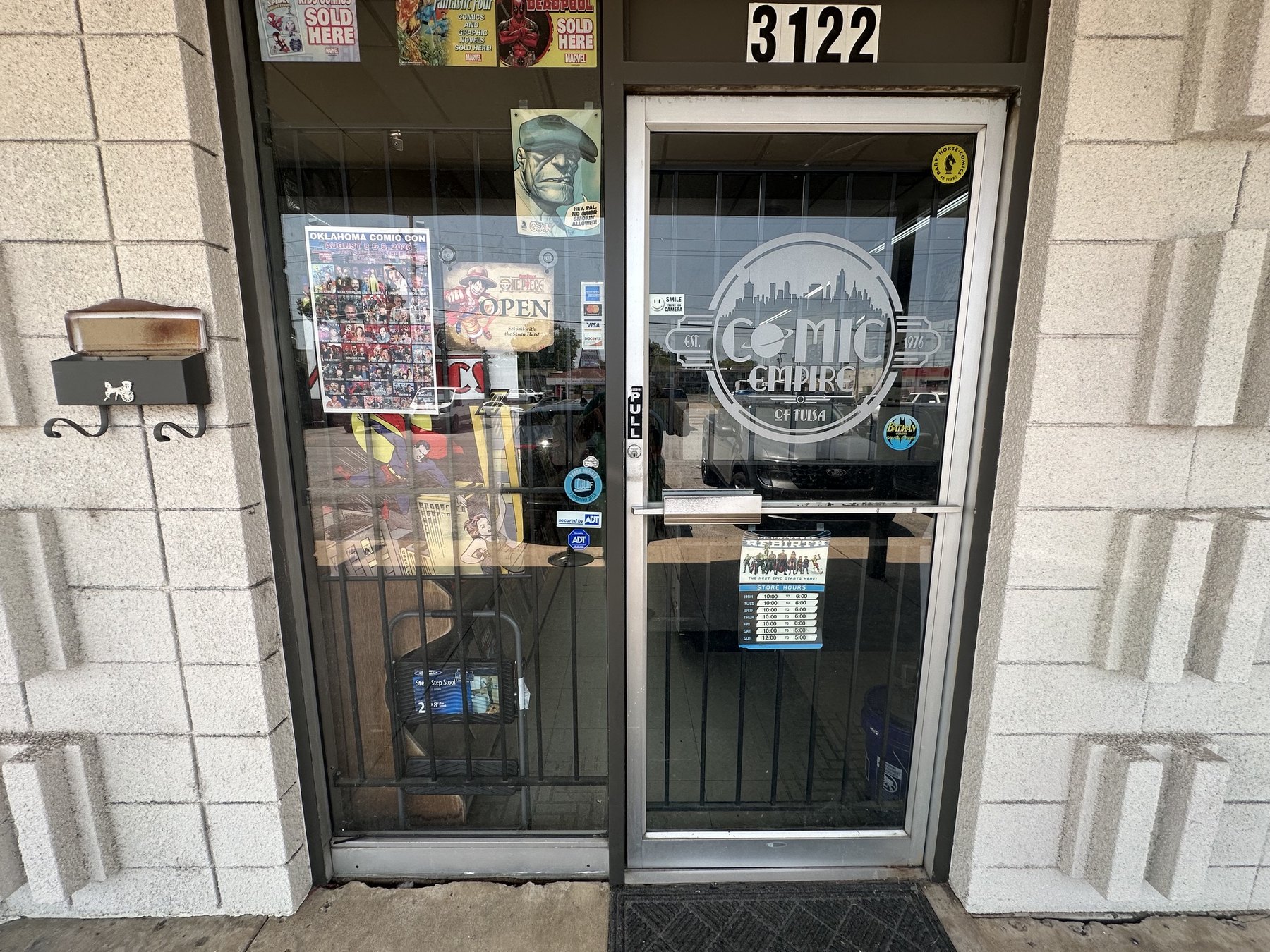 Front door of The Comic Empire in Tulsa with address number 3122