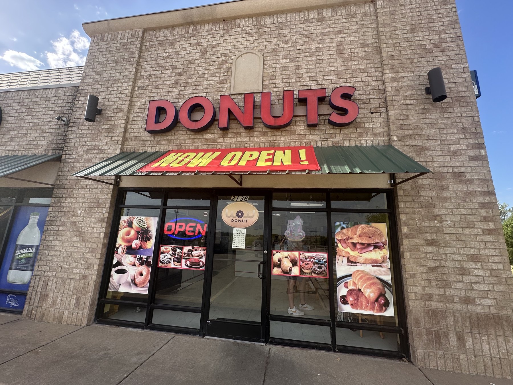 Wow Donuts storefront in Edmond with a Now Open banner