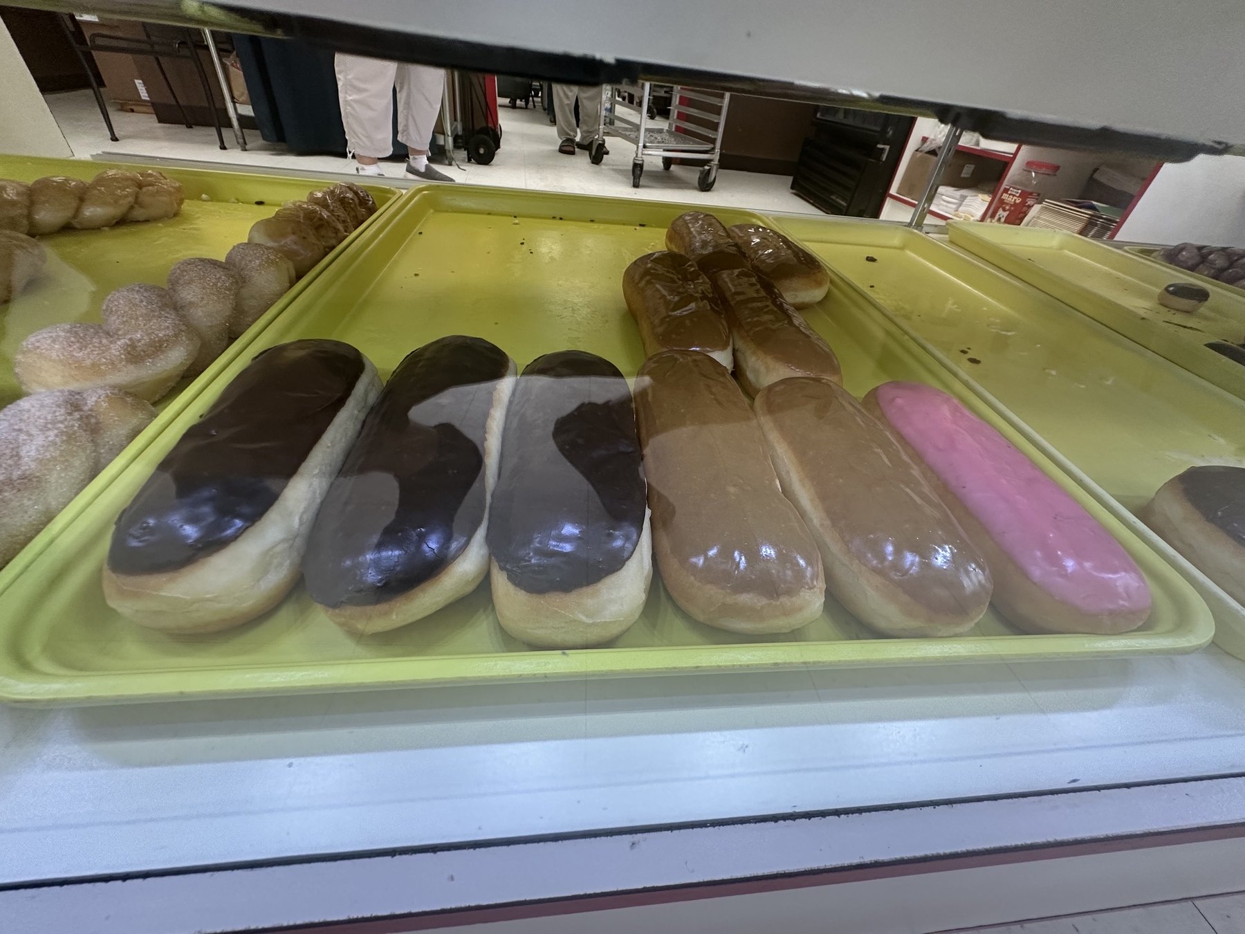 Chocolate, maple, and pink iced long john donuts at Wow Donuts in Edmond