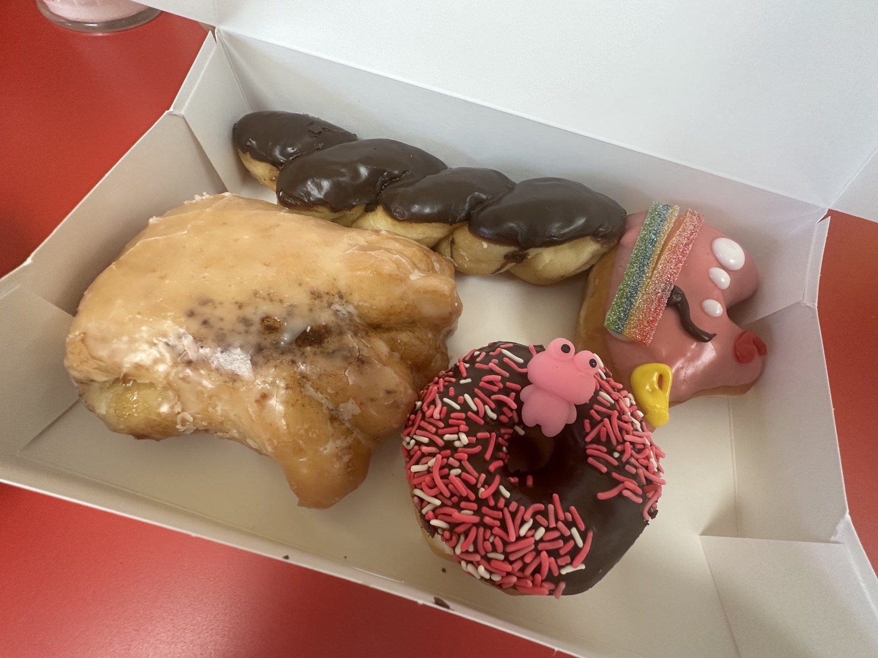 Mixed box of donuts and novelty pastries from Wow Donuts in Edmond