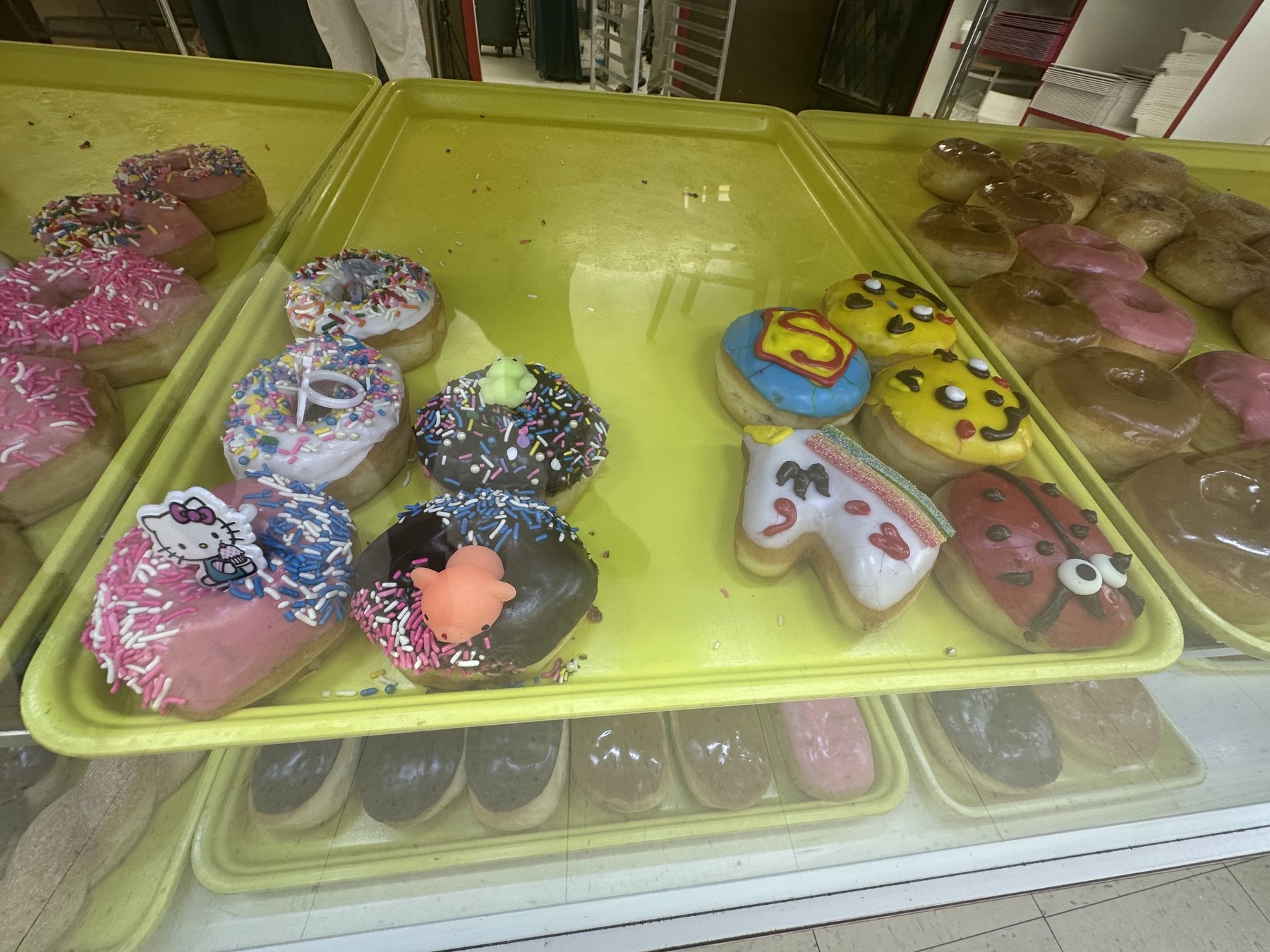 Novelty character donuts including a unicorn and emoji designs at Wow Donuts in Edmond