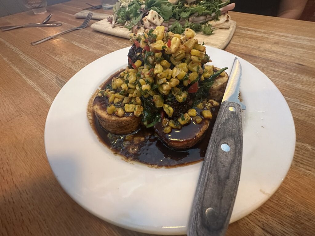 Short rib entree topped with corn relish and served with potatoes at Pizzeria Gusto in Oklahoma City.