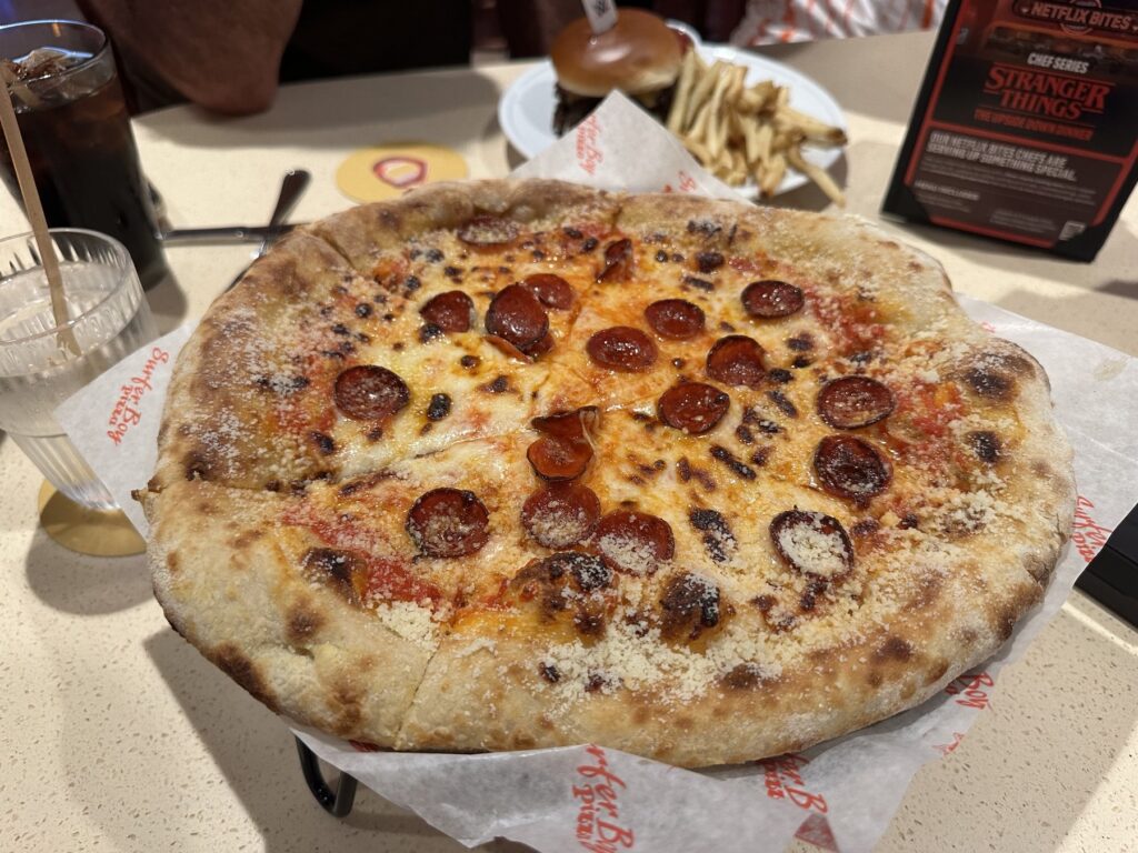 Pepperoni Surfer Boy Pizza served at Netflix Bites Dallas on branded paper
