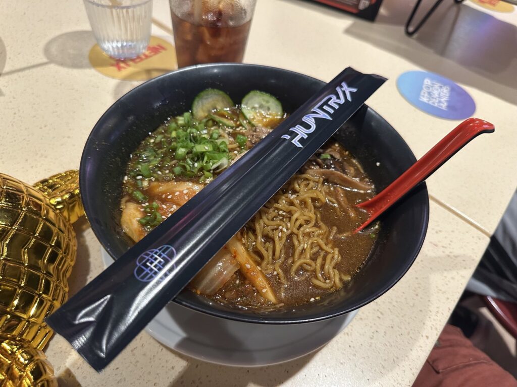 Huntr/x themed ramen noodle bowl with chopsticks at Netflix Bites Dallas