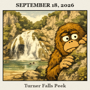 A furry Bigfoot peeks from behind a mossy rock beside Turner Falls in Davis, with a lush gorge and cascading waterfall.