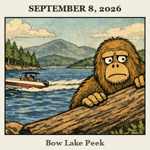 Bigfoot peeks from behind a log at the edge of a deep blue lake, with boats, trees, and distant mountains.
