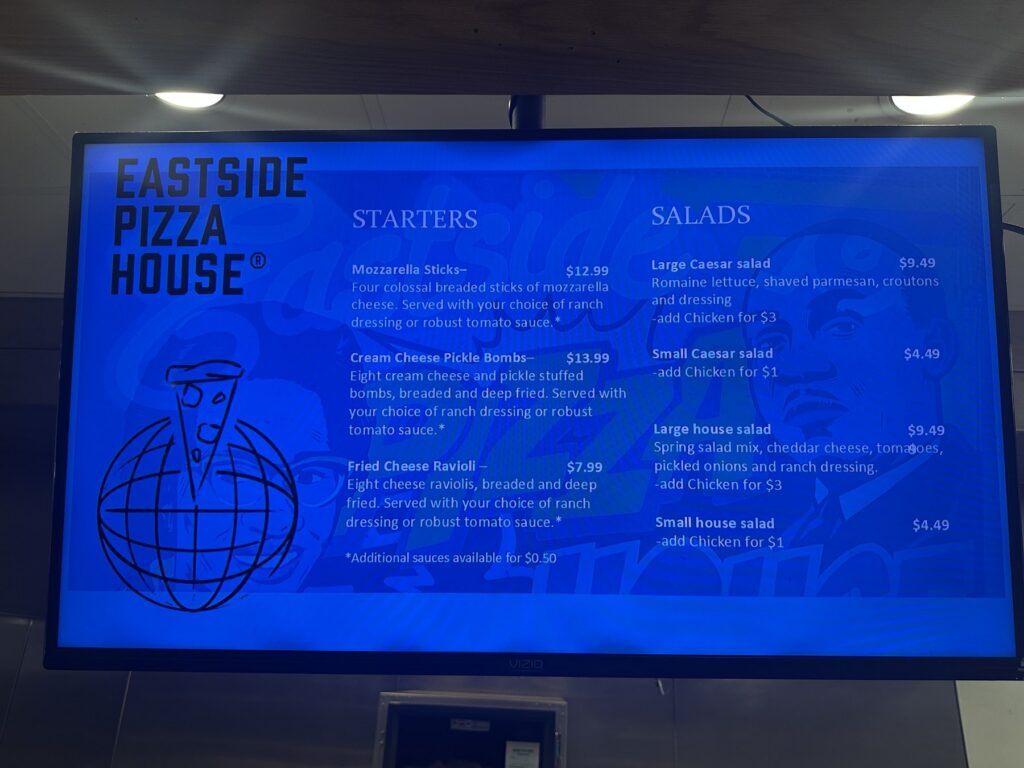 Eastside Pizza House menu board showing starters and salads