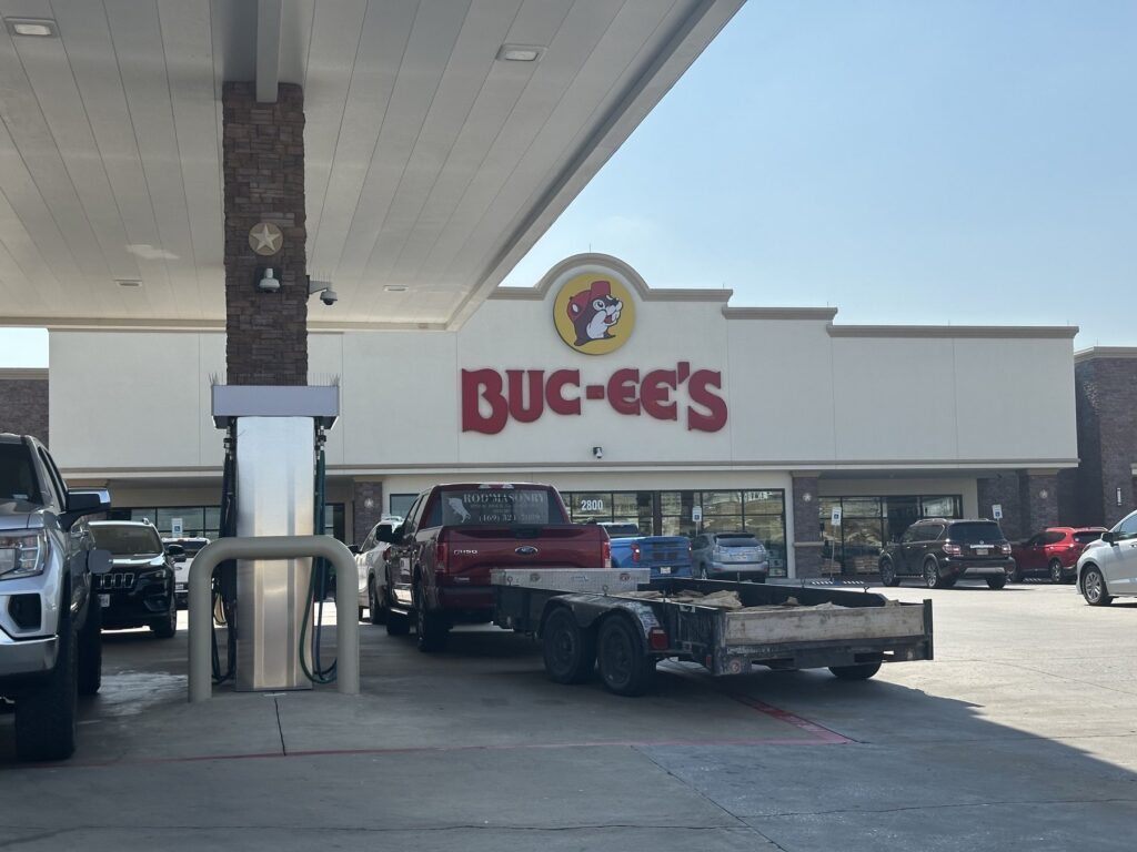 Buc-ee's storefront in Denton, Texas, viewed from the gas pumps